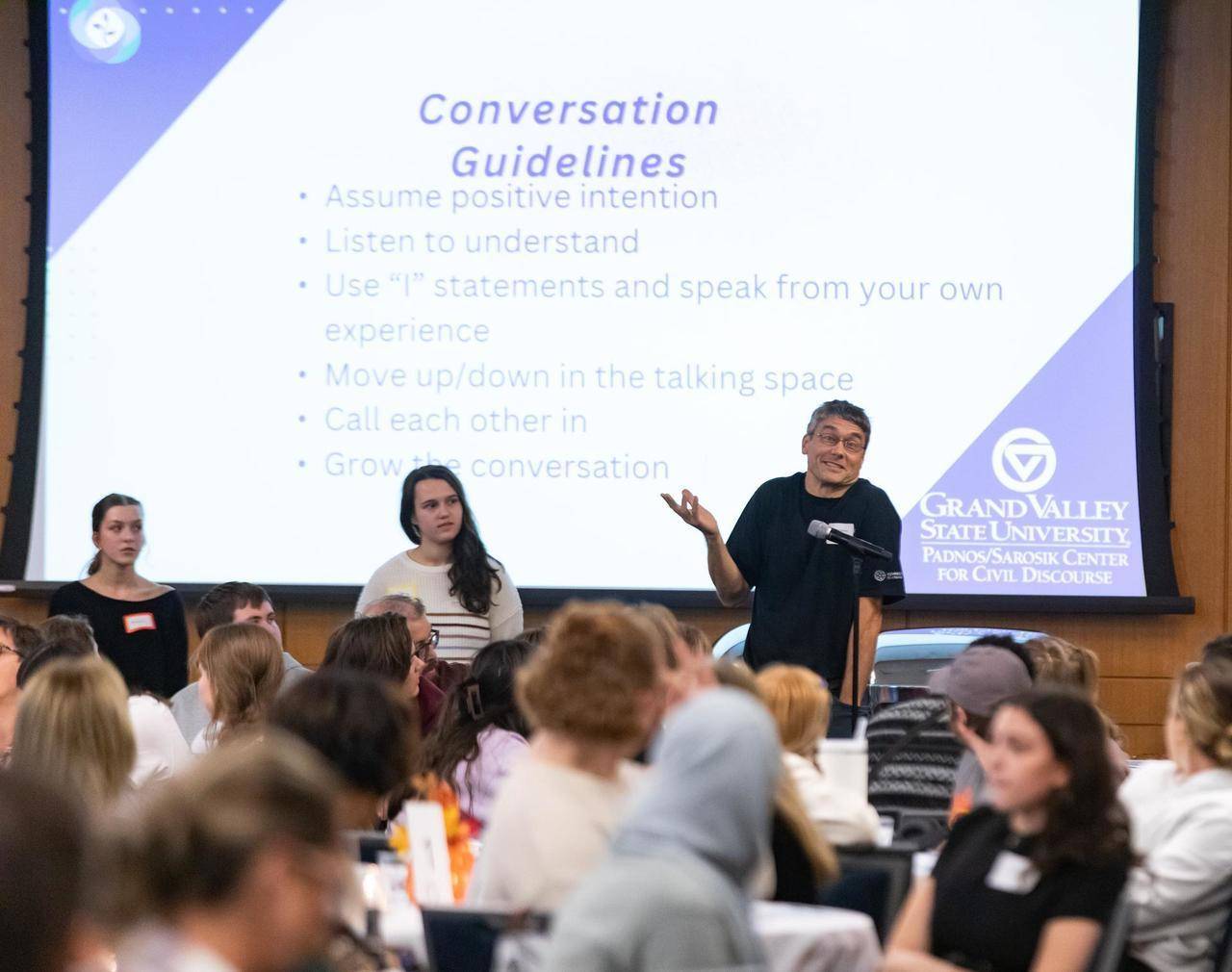 The question and answer portion of the program, a man asking a question at the microphone